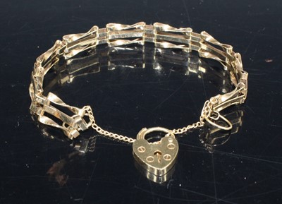 Lot 398 - A modern 9ct gold gatelink bracelet, with...