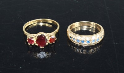 Lot 406 - A 9ct gold triple garnet set dress ring, size...