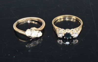 Lot 409 - A 9ct gold and moissanite set three-stone ring,...