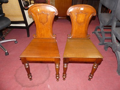 Lot 1365 - A pair of mid-Victorian oak panelled seat hall...