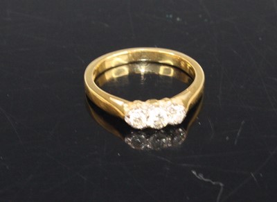 Lot 415 - An 18ct gold diamond three-stone ring, 3g, size J