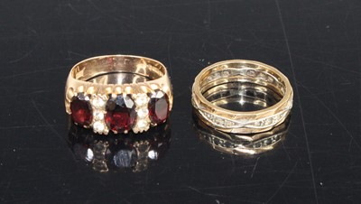 Lot 416 - A 9ct gold, garnet and moissanite set dress...