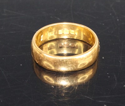 Lot 417 - A 22ct gold court shaped wedding band, sponsor...