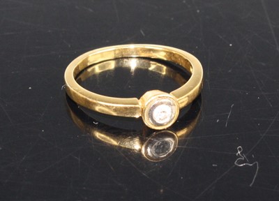 Lot 419 - A 9ct gold diamond solitaire ring, the bezel...