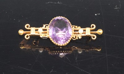 Lot 423 - A 15ct gold, amethyst and seed pearl bar...