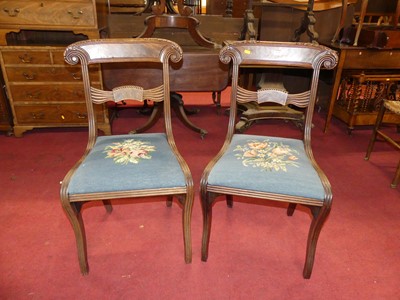 Lot 1378 - A pair of William IV mahogany floral scroll...