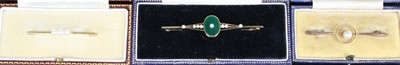 Lot 427 - A 15ct gold, green hardstone and seed pearl...