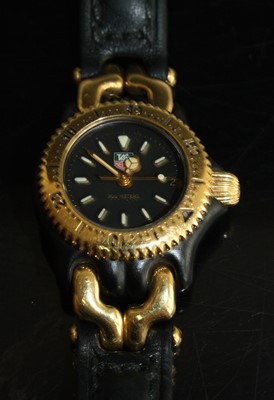 Lot 433 - A lady's Tag Heuer quartz wristwatch S93.308C...