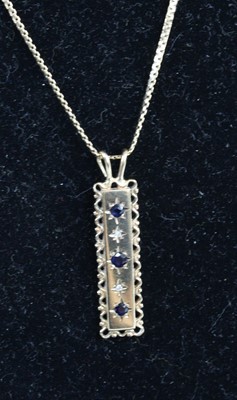 Lot 437 - A modern 9ct gold, sapphire and diamond point...