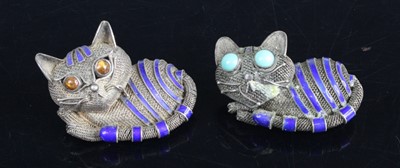 Lot 445 - A pair of filigree blue enamel cat brooches,...