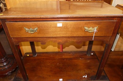 Lot 1392 - A 19th century mahogany single drawer side...