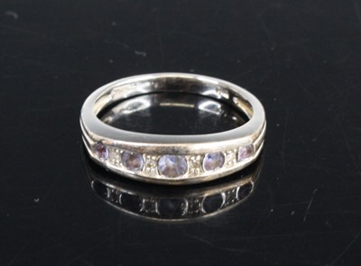 Lot 446 - A modern 9ct white gold, sapphire and diamond...