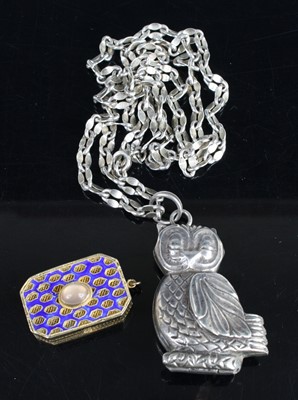 Lot 448 - A reproduction white metal pendant locket in...