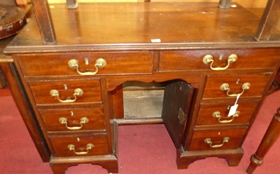 Lot 1394 - A 19th century kneehole desk, having an...