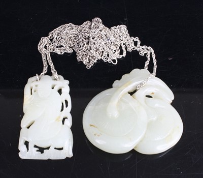 Lot 453 - A Chinese carved celadon jade pendant...