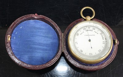 Lot 457 - A gilt metal cased pocket barometer, having...