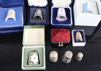 Lot 460 - A collection of thimbles, to include silver...