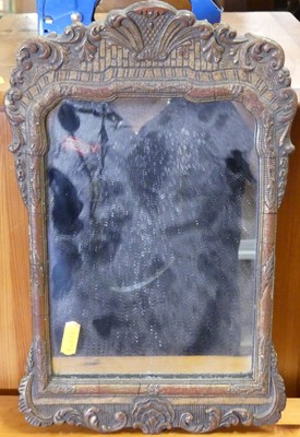 Lot 1107 - A gilt composition framed oval wall mirror,...