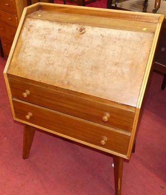 Lot 1406 - A 1960s walnut slope front two-drawer writing...