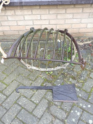 Lot 1437 - A cast iron wall mounted hay rack; together...