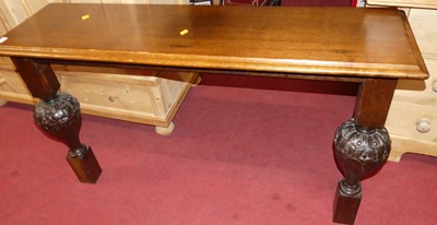 Lot 1419 - An oak console table raised on carved bulbous...