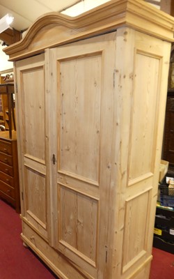 Lot 1420 - A French pine double door armoire, with...