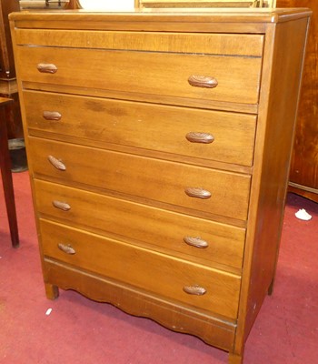 Lot 1421 - A mid-20th century Lebus oak chest of five...