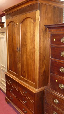 Lot 1426 - A contemporary hardwood double door wardrobe,...