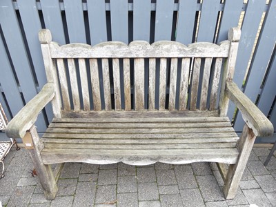 Lot 1451 - A contemporary slatted teak three-seater...