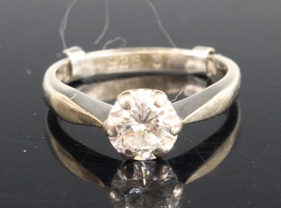 Lot A white metal diamond solitaire ring,...