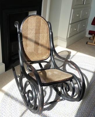 Lot 1310 - After Thonet - an ebonised bentwood rocking...