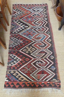 Lot 1261 - A Persian woollen Kelim rug, decorated with...