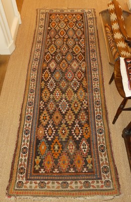 Lot 1259 - A Persian woollen Shirvan rug, the brown...
