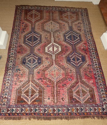 Lot 1265 - A Persian woollen Shiraz rug, decorated with...