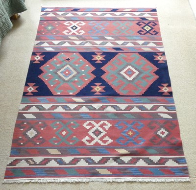 Lot 1263 - A Persian woollen Kelim rug, decorated with...
