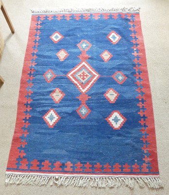 Lot 1264 - A Persian woollen Kelim rug, having a blue...