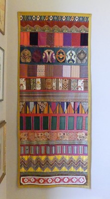 Lot 1129 - An African cotton and silk wall hanging,...