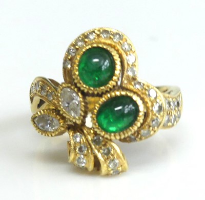 Lot 2605 - A yellow metal, emerald and diamond floral...