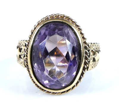 Lot 2611 - A 9ct yellow gold amethyst set dress ring, the...