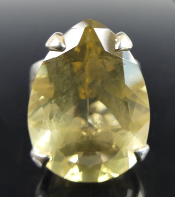 Lot 2630 - A silver citrine dress ring, the pear cut...