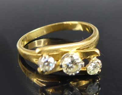 Lot 2664 - An 18ct gold diamond abstract three-stone ring,...