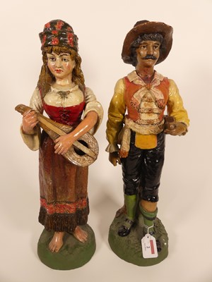 Lot 2 - A pair of Spanish pottery figures of musicians,...