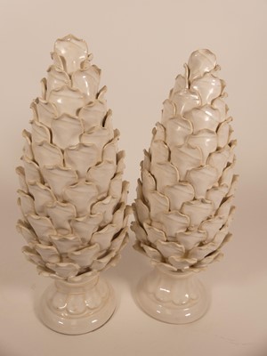 Lot 6 - A pair of glazed pottery finials in the form...