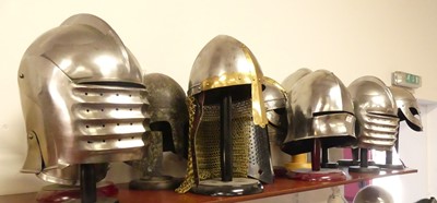 Lot 16 - A collection of reproduction metal helmets