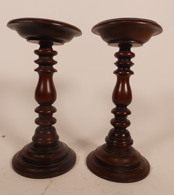 Lot 21 - A pair of turned hardwood stands, h.27cm