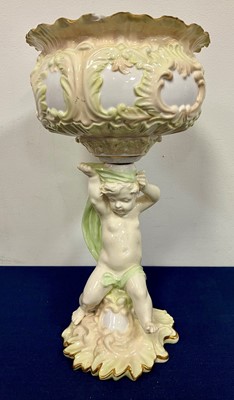 Lot 34 - A porcelain table centrepiece, having a floral...