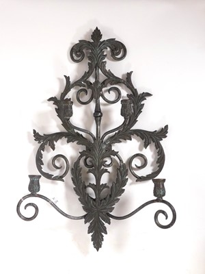 Lot 102 - A contemporary iron four-branch wall sconce,...