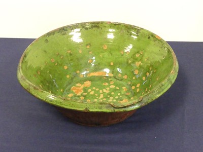 Lot 120 - A green glazed pottery dairy bowl, dia.43cm