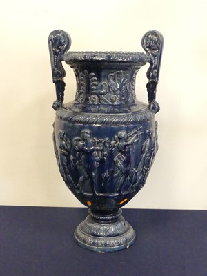 Lot 121 - A blue glazed pottery urn in the classical...