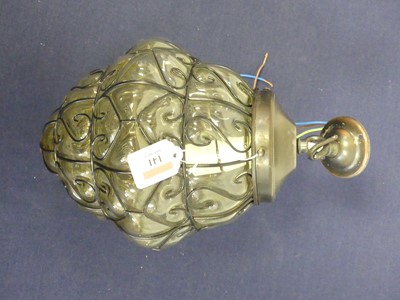 Lot 141 - A metal overlaid glass pendant light, h.29cm